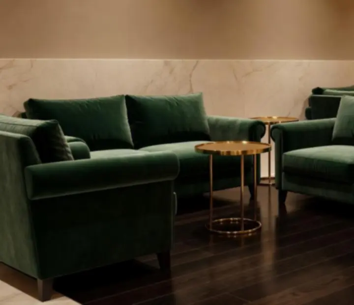 Emerald velvet lounge with gold accents and warm lighting